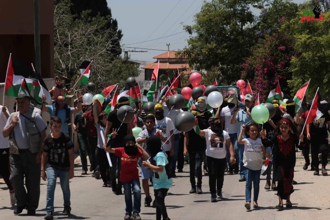 الأعلام الفلسطينية ترفرف في كفر قدوم ردا على مسيرة الأعلام المرتقبة